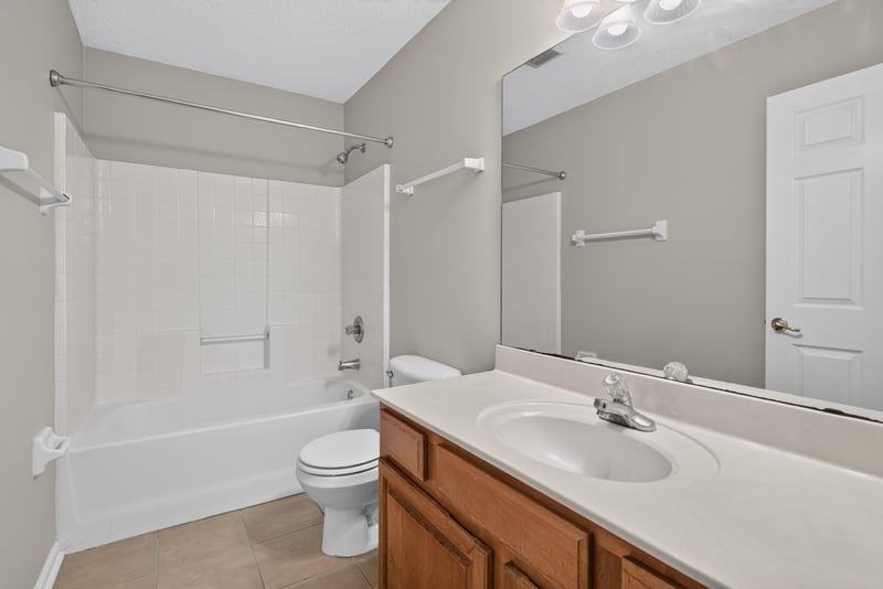 Bathroom with tub-shower combo and vanity at 11669 Collins Creek Dr, Jacksonville, FL 32258