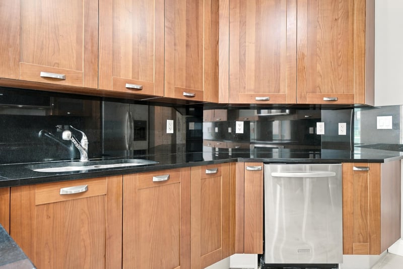 Kitchen with black backsplash and counters, photographed by Megapixeler on Riverplace Blvd, Jacksonville