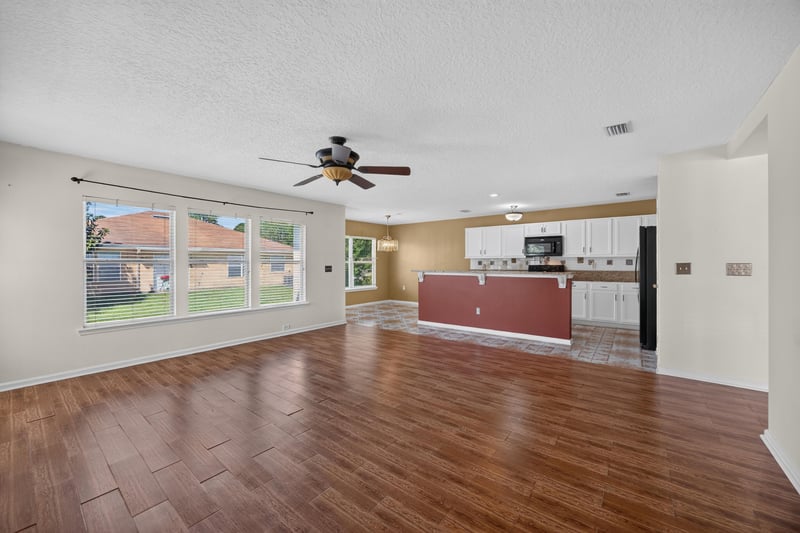 Empty open floor plan toward kitchen island at 2282 Justin Lake Dr, Jacksonville, FL