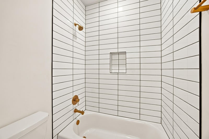 Bathroom shower and tub with tile surround at 907 Seagrove Dr, Ponte Vedra Beach, FL 32081