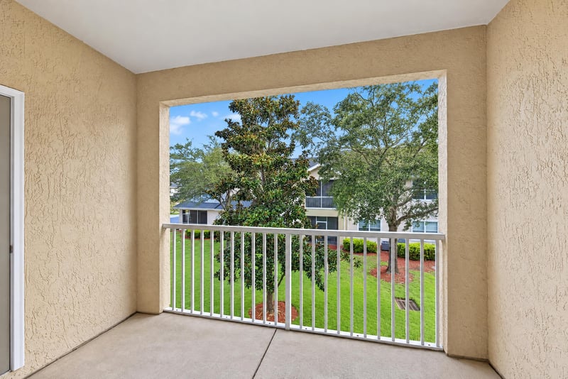Balcony with railing and tree view at 3750 Silver Bluff Blvd, Orange Park, FL