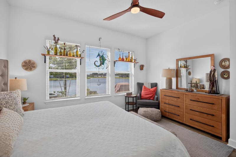 Bedroom with wood dresser and mirror at 129 Amberwood Dr, St. Augustine, FL