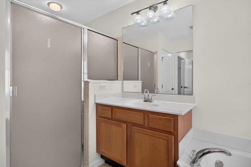 Primary bathroom vanity with tile floor at 2131 E Stone Creek Dr, Fleming Island, FL