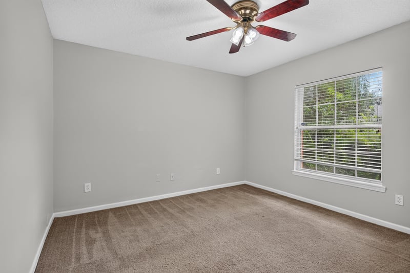 Empty carpeted room with window at 11669 Collins Creek Dr, Jacksonville, FL 32258