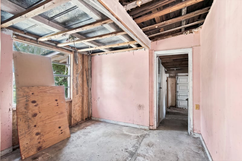 Room under renovation with exposed ceiling framing at 1807 Idlewild Ave, Green Cove Springs, FL