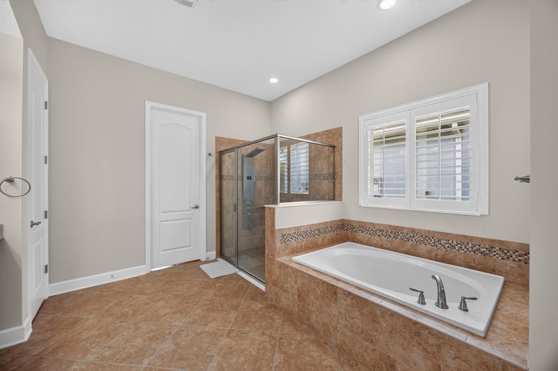Bathroom with soaking tub and tile surround at 276 Cross Ridge Dr, Ponte Vedra Beach, FL 32081