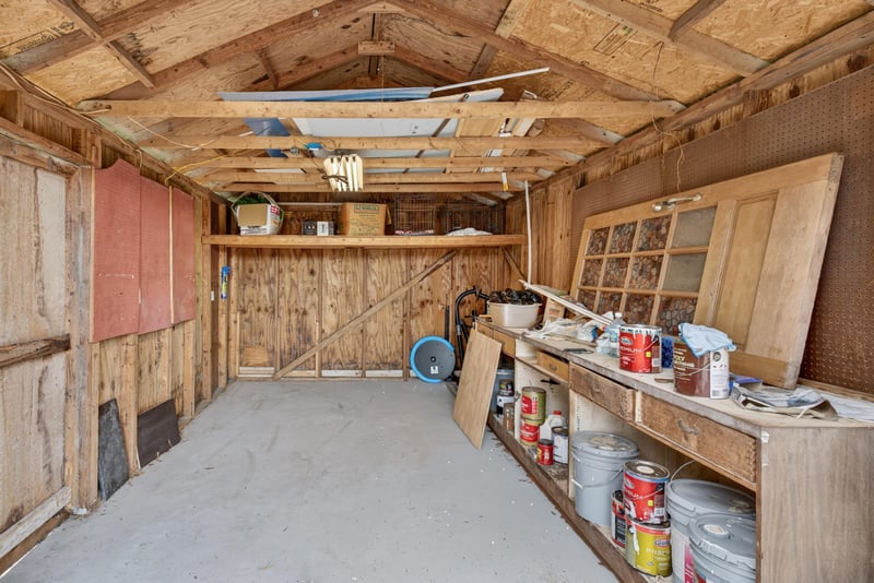 Workshop interior with built-in wood shelving at 217 Baisden Rd, Jacksonville, FL 32218