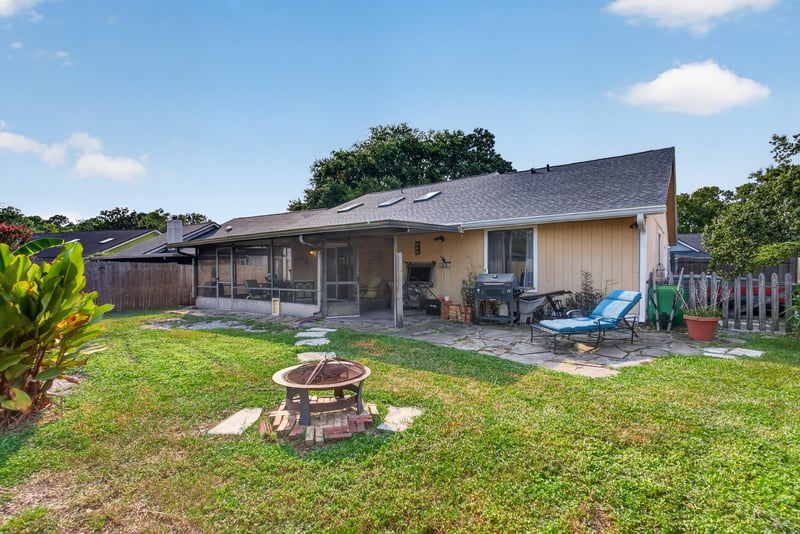 Backyard with patio and fire pit at 13020 Medford Ln, Jacksonville, FL 32225