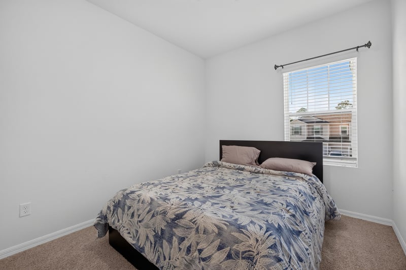 Bedroom with window facing the pond at 339 Anthony Dr, Jacksonville, FL