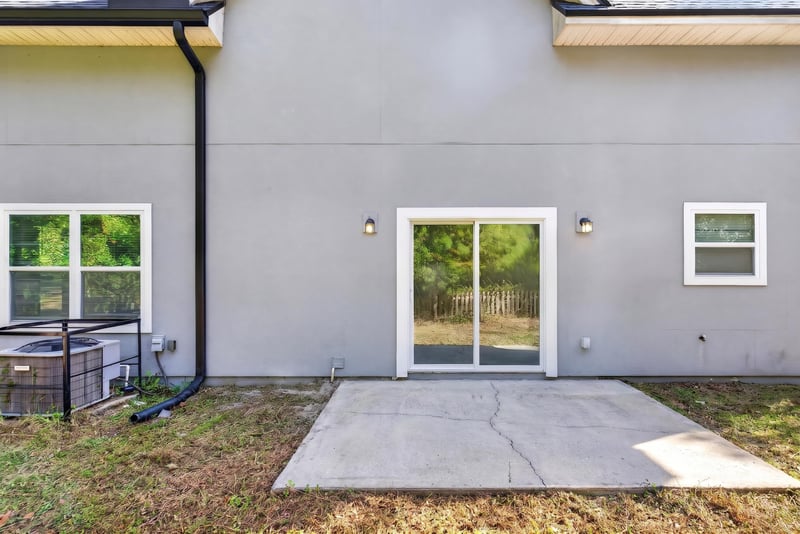 Side exterior with patio, photographed by Megapixeler on Lem Turner Rd, Jacksonville