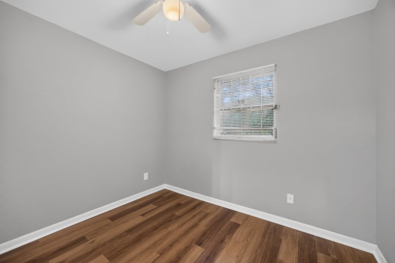 Empty room with wood-look flooring at 4030 Leonard Cir W, Jacksonville, FL 32209
