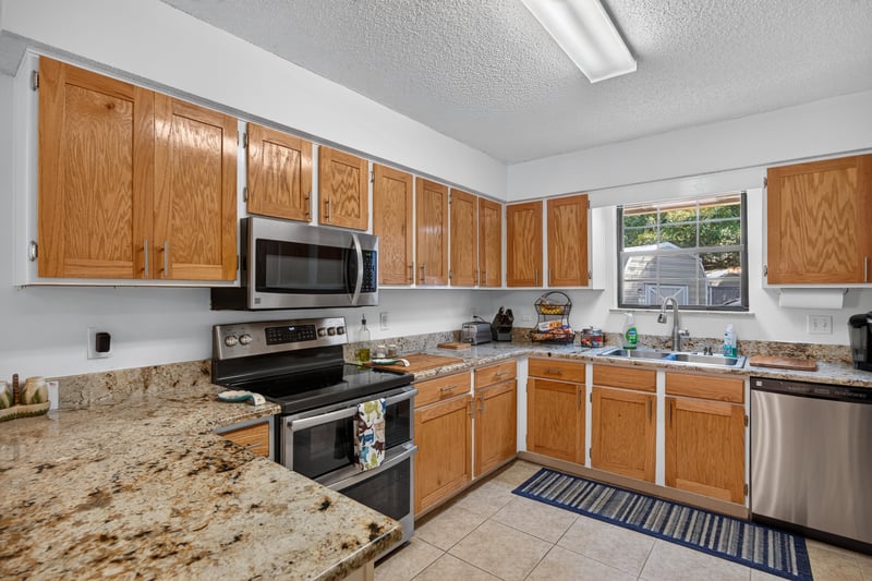 Kitchen counter and stainless range at 2435 Range Line Rd, Middleburg, FL