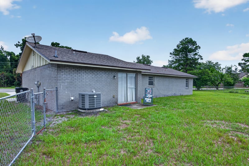 Backyard view with chain link fence and AC unit at 1143 Tumbleweed Dr, Orange Park, FL 32065