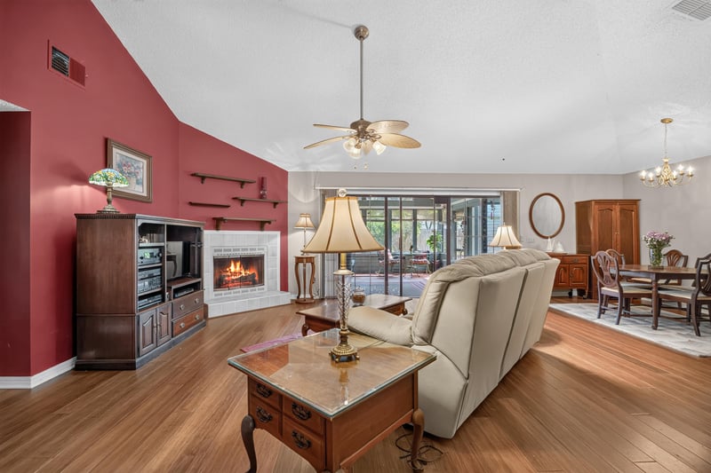 Living room with fireplace and built-in shelving at 4837 Pareja Ct, Jacksonville, FL 32225