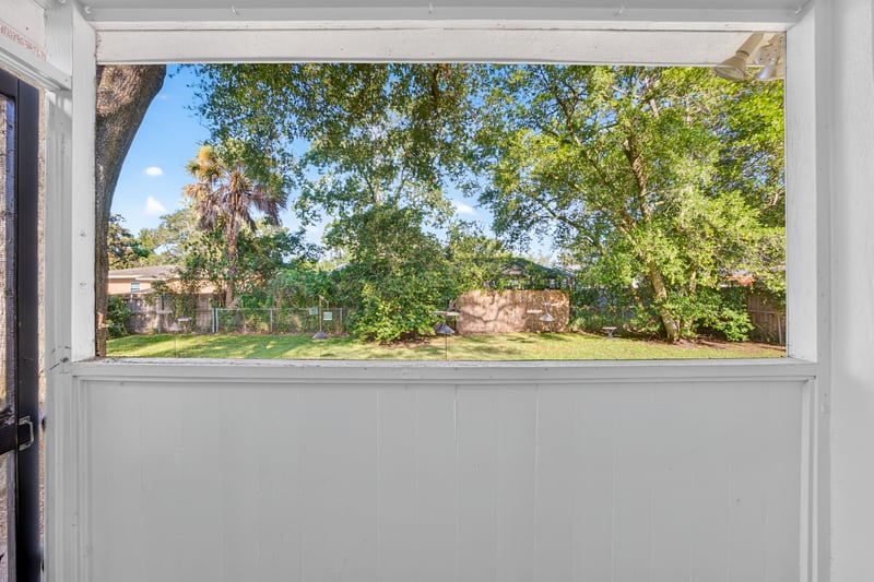 Sunroom pass-through window overlooking the backyard at 6338 Mercer Cir W, Jacksonville, FL
