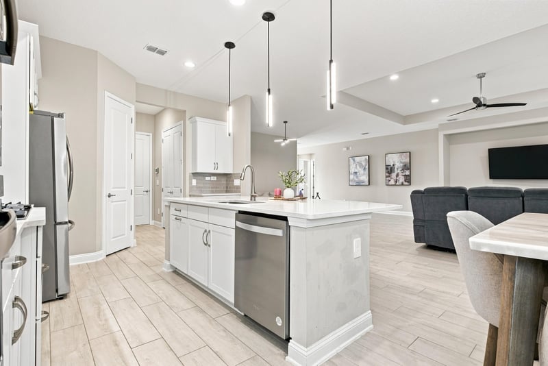Kitchen view toward living room with tray ceiling at 27 Holly Rdg Wy, St. Augustine, FL