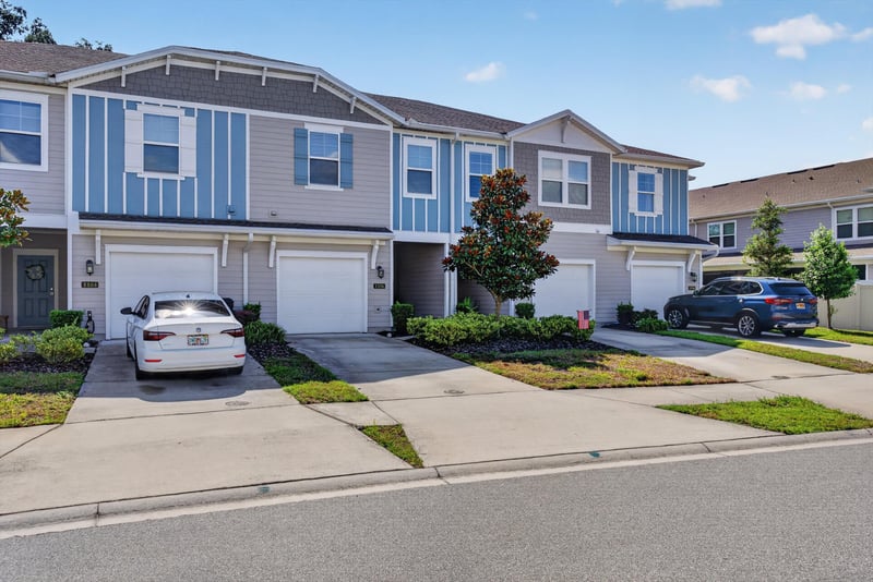 Front exterior with driveway and garage at 1186 Beach Dune Dr, Jacksonville, FL 32233