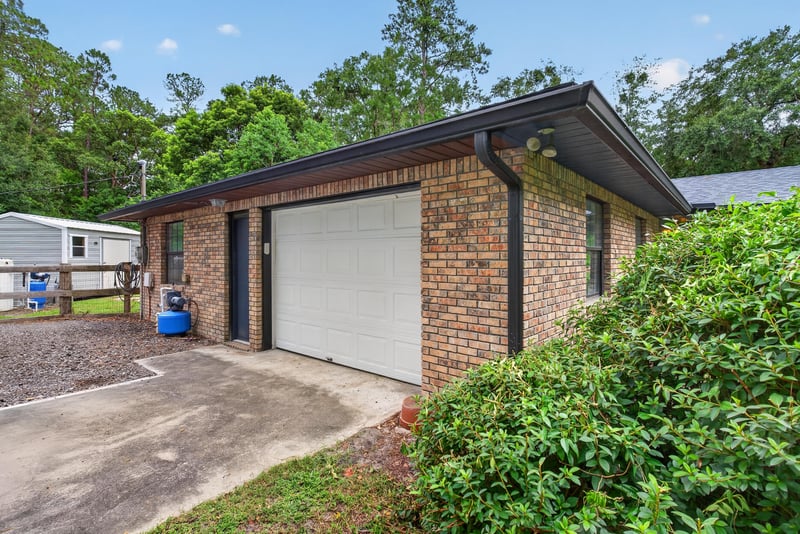 Detached brick outbuilding with garage door at 3249 Maryland Ave, Green Cove Springs, FL