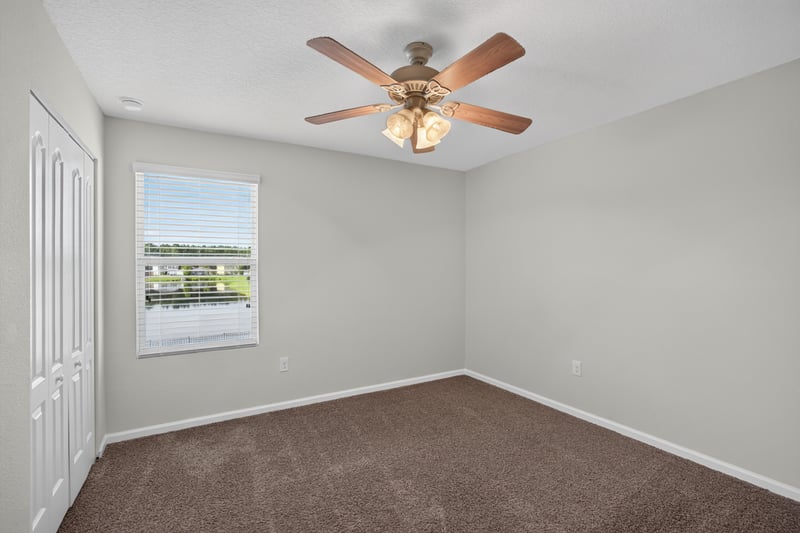 Bedroom with ceiling fan and window at 6830 Hanford St, Jacksonville, FL 32219