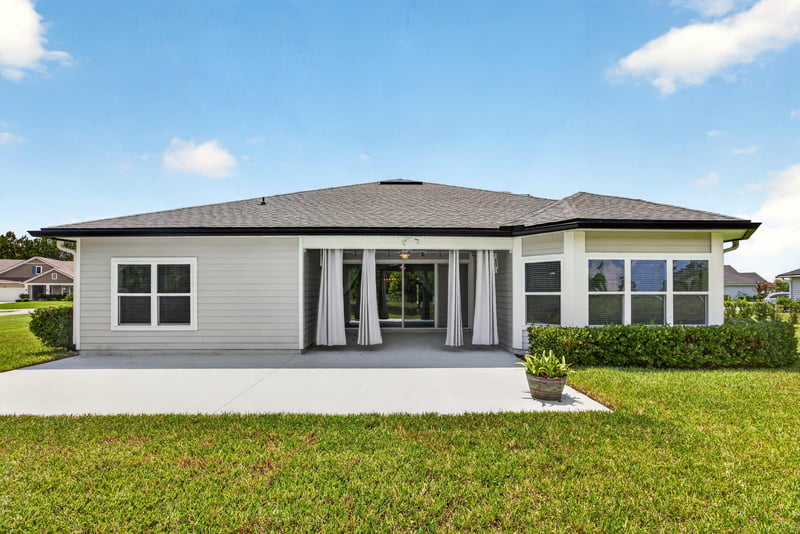 Covered back patio and rear exterior of home at 53 Lumen Ct, St. Augustine, FL 32095