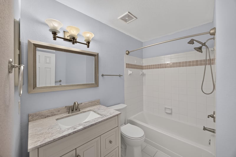 Bathroom with vanity and tub-shower combination at 10150 Belle Rive Blvd, Jacksonville, FL