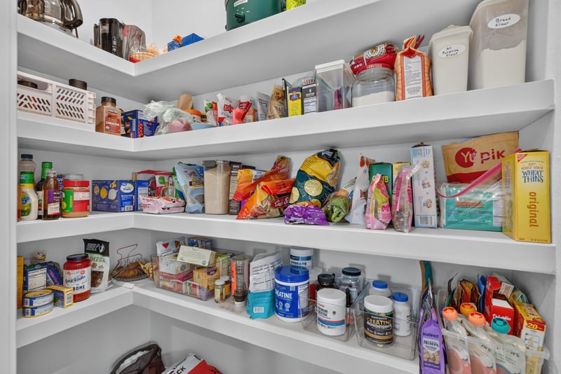 Pantry with stocked shelving at 4276 Quaking St, Jacksonville, FL 32218