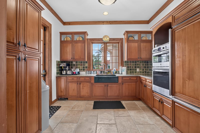 Clubhouse kitchen with wood cabinets in Murabella