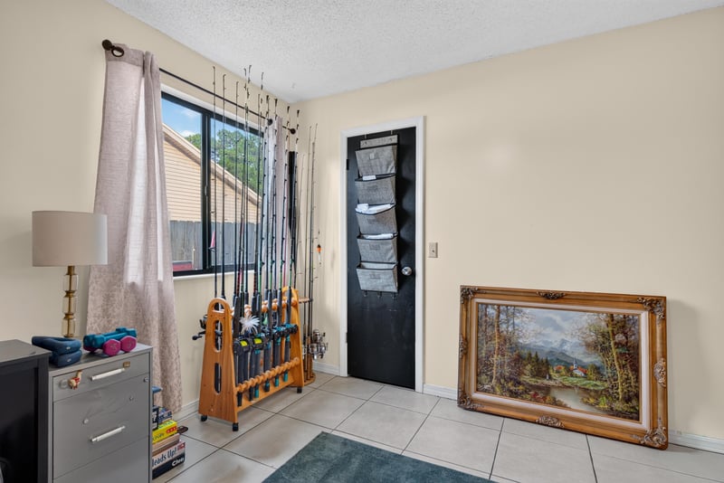 Bedroom with curtains and storage cabinet at 13020 Medford Ln, Jacksonville, FL 32225