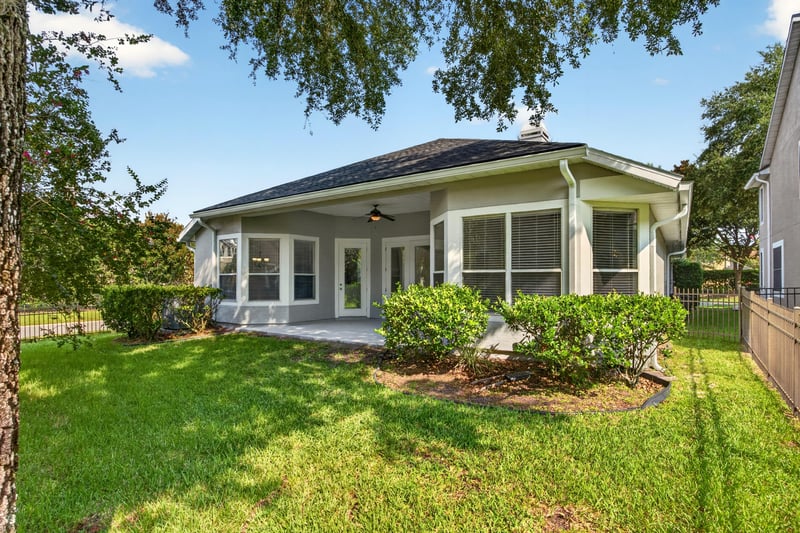Rear exterior with screened porch at 3101 E Banister Rd, St. Augustine, FL 32092