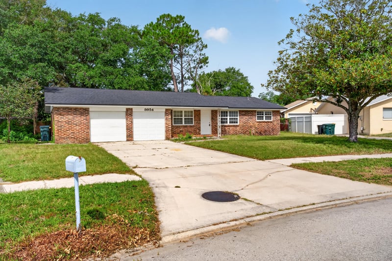 Front exterior view with mailbox and driveway at 9954 Larkdale Ct, Jacksonville, FL 32257