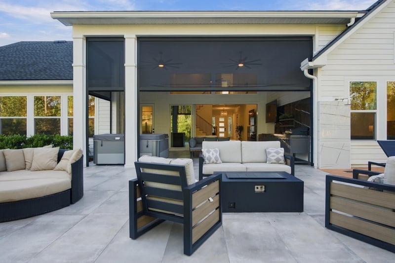Covered patio with sliding doors open to the great room at 907 Seagrove Dr, Ponte Vedra Beach, FL 32081