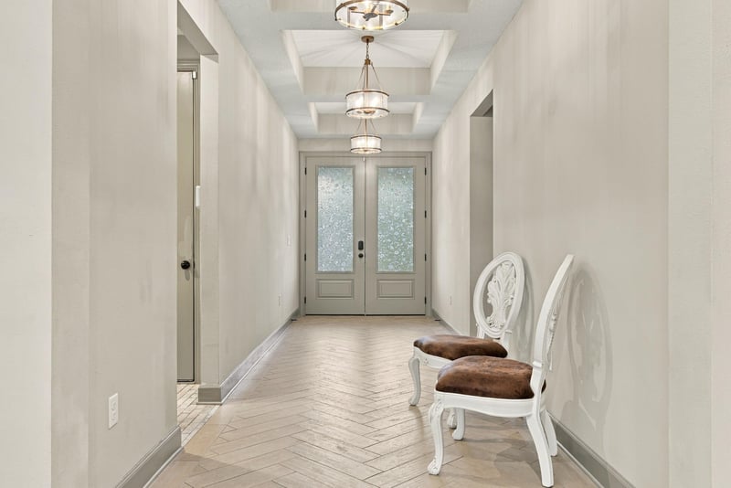 Foyer with glass-paneled doors and tile floor at 3921 Spyglass Hill Ln