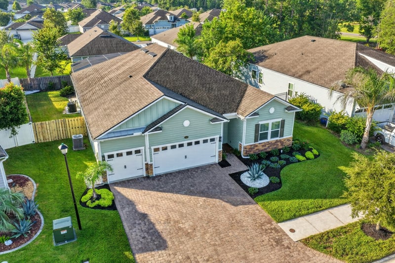 Aerial side view of the roof and yard at 3328 Southern Oaks Dr, Green Cove Springs, FL 32043