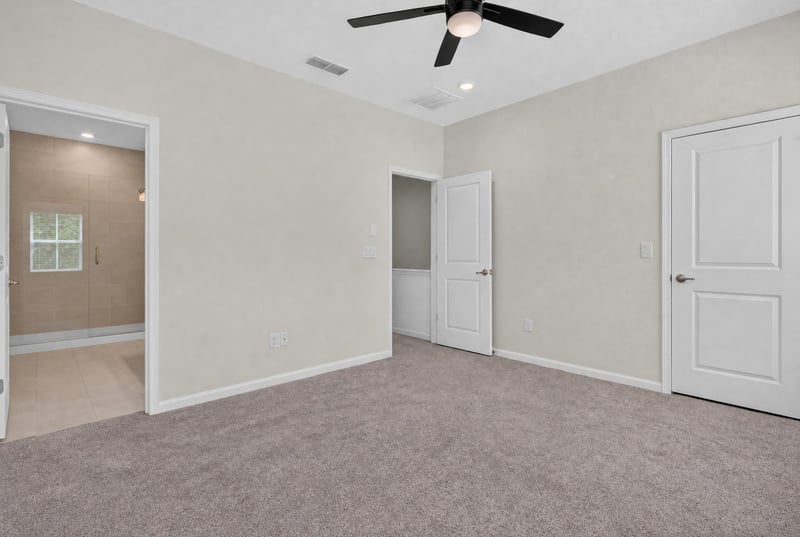 Bedroom with closet doors and carpet at 39 Mellowood Ln, St. Augustine, FL 32092