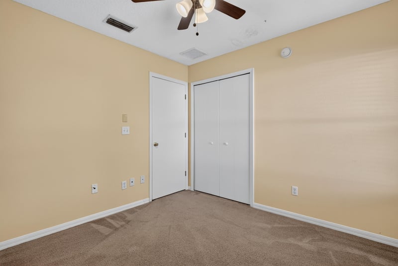 Empty room with carpet and interior doors at 353 Redwood Ln