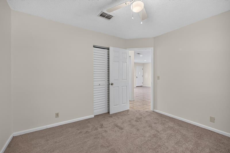 Bedroom with carpet and hallway view at 2829 Blackberry Ave