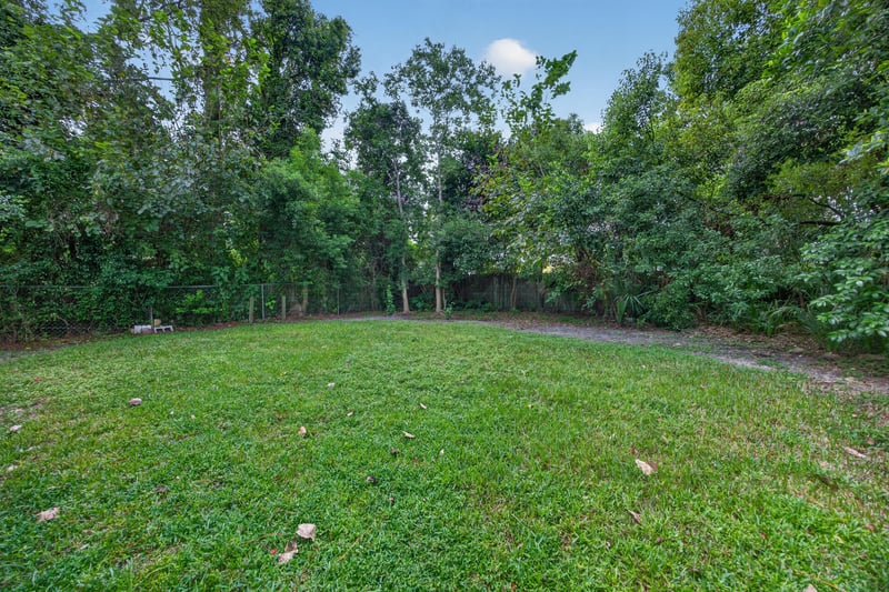 Backyard, open lawn and tree line at 2256 Inwood Cir S, Jacksonville, FL