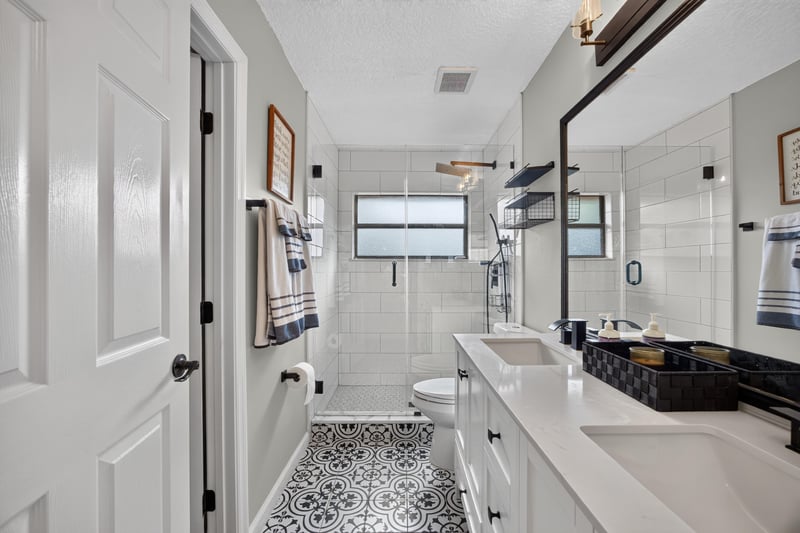 Bathroom with marble tile shower at 2125 Blue Heron Cove Dr, Orange Park, FL 32003