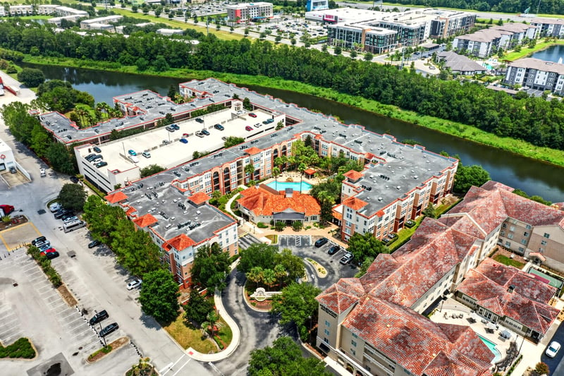 Aerial view of the condo complex and parking at 10435 Mid Town Pkwy unit 135, Jacksonville, FL 32246