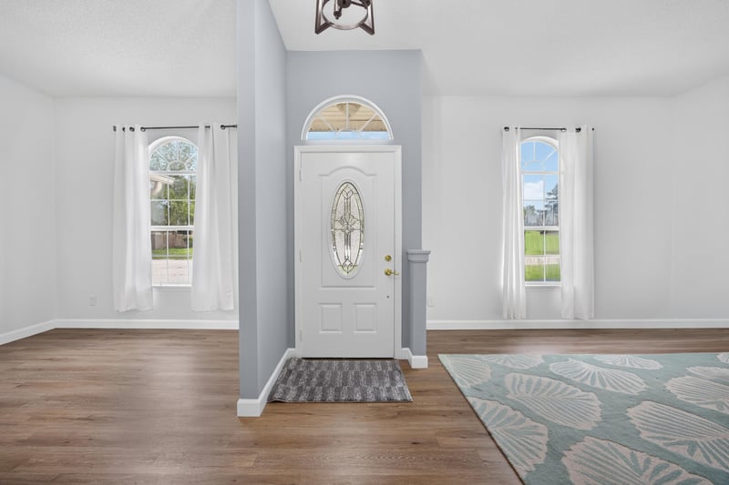 Foyer with front door and sidelight windows at 8921 Needlepoint Pl, Jacksonville, FL 32244