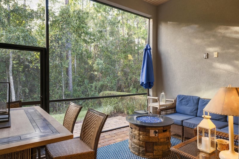 Screened porch with outdoor seating, photographed by Megapixeler on Lucena Ln, Jacksonville, FL