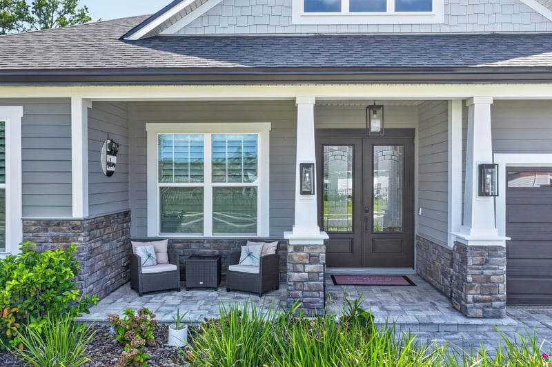 Covered front porch with double entry doors at 785 Back Creek Dr, St. Augustine, FL 32092