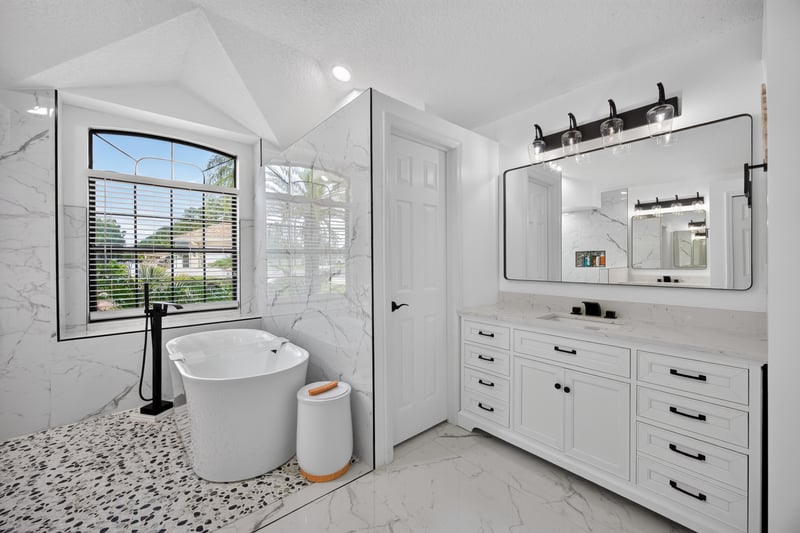 Bathroom with freestanding tub and marble floor at 2125 Blue Heron Cove Dr, Orange Park, FL 32003