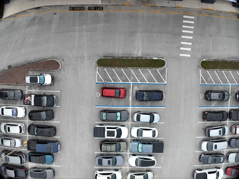 Aerial view of parking lot with striped crosswalk at 9406 Atlantic Blvd, Jacksonville, FL 32225