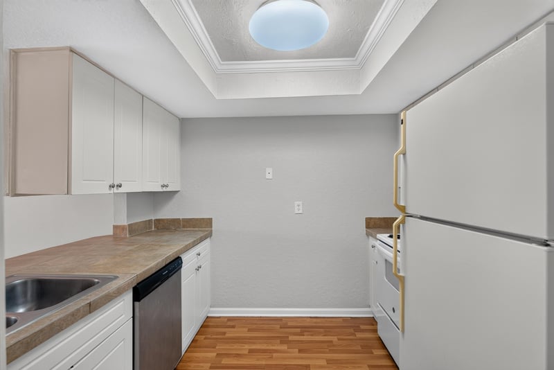 Kitchen with skylight and tile counter at 3866 Campenero Ct unit 6, Jacksonville, FL 32217