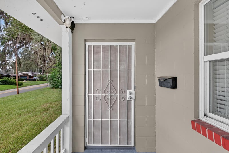 Front entry with security screen door at 217 Baisden Rd, Jacksonville, FL 32218