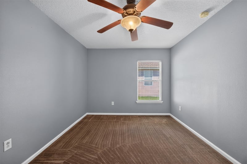 Empty bedroom with window and carpet at 2282 Justin Lake Dr, Jacksonville, FL