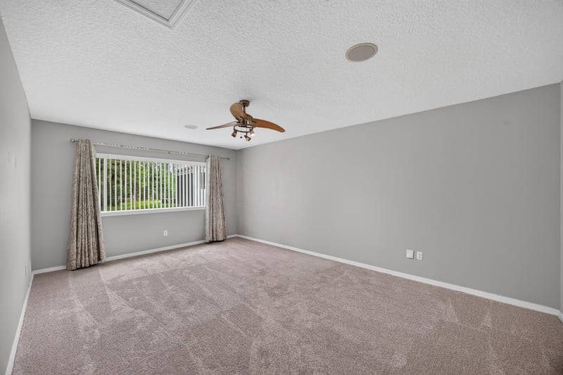 Bedroom with ceiling fan and window at 635 Wakeview Dr, Orange Park, FL 32065