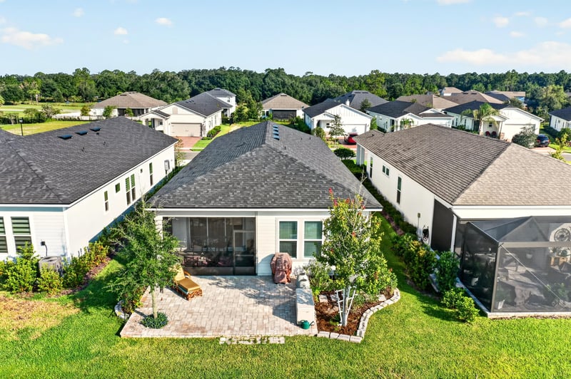 Front exterior with landscaping and covered porch at 129 Amberwood Dr, St. Augustine, FL