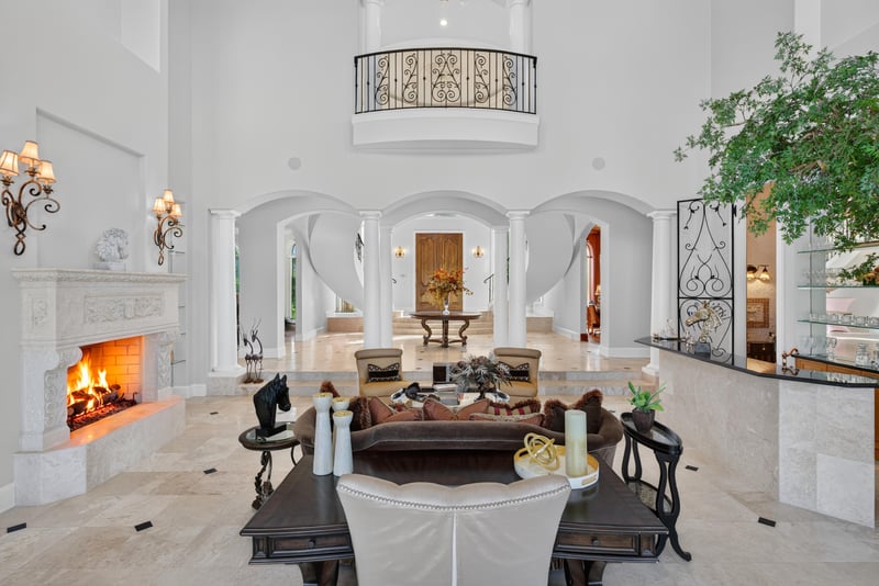 Living room with fireplace and balcony above at 344 Broward Rd, Jacksonville, FL